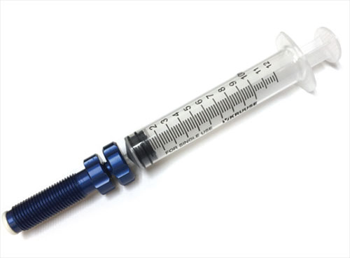Aluminium injector met spuit